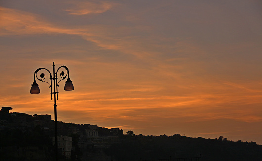 street lamp during the sunset on the beach in italy
