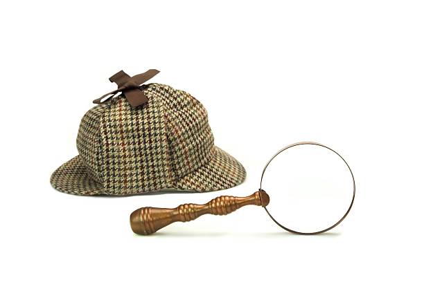 istock Detective Deerstalker Cap And Vintage Magnifying Glass Isolated 481873984