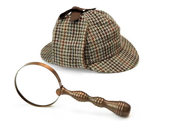 istock Deerstalker Cap And Vintage Magnifying Glass Isolated on White 481874010