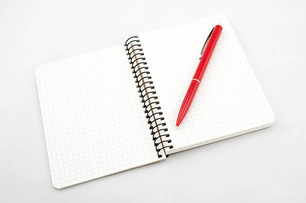 Notebook Opened new notebook and red pencil placed on the gray background workbook paper checked mesh stock pictures, royalty-free photos & images