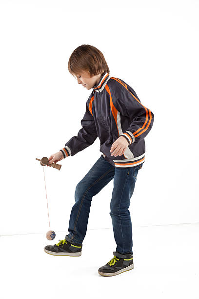 boy with kendama stock photo