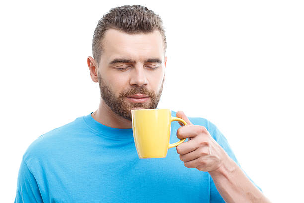 istock Man with beard holding cup of coffee 481880080