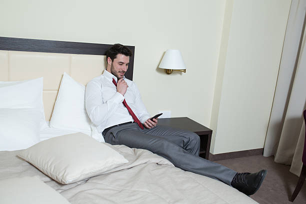 istock Young businessman sending message with mobile phone 481880615