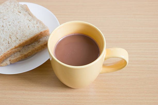 istock Cup of coffee toast on wooden table 481882061