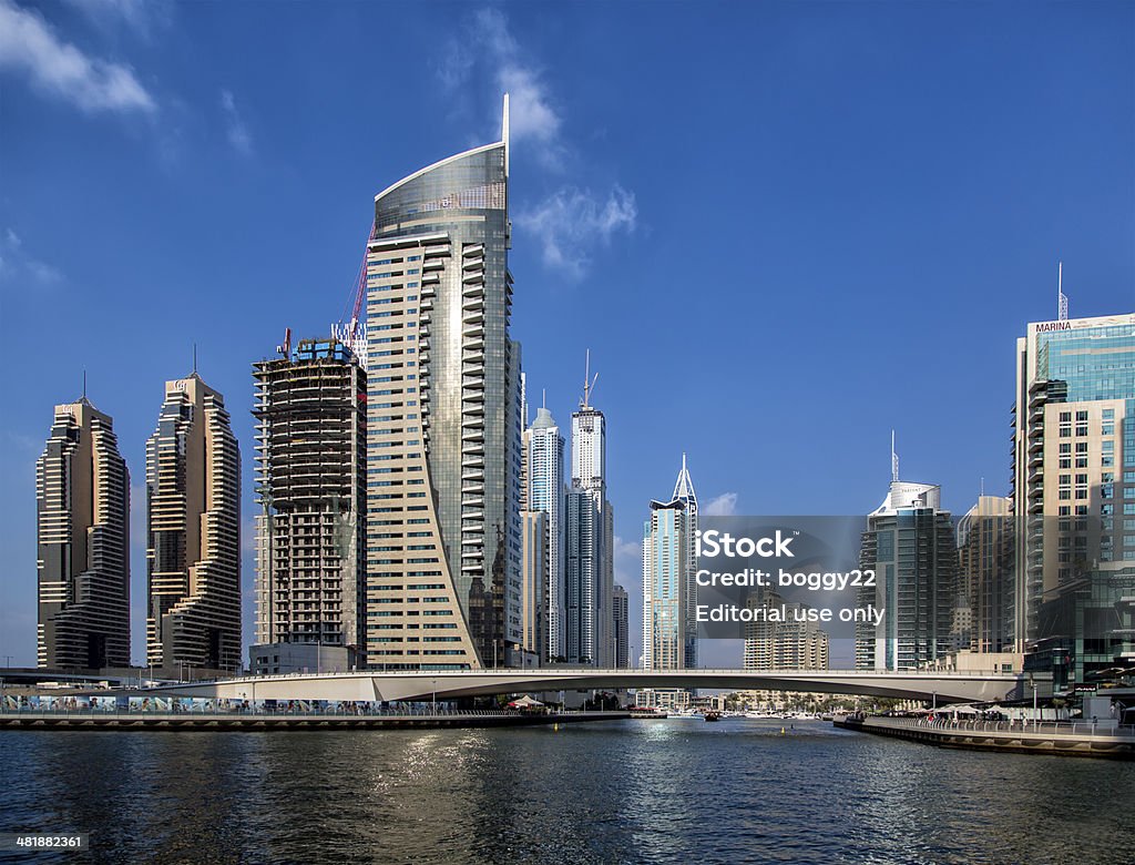 Dubai Marina Dubai, UAE - January 16, 2014: View at modern skyscrapers in Dubai Marina in Dubai, UAE. When the entire development is complete, it will accommodate more than 120,000 people. Arabia Stock Photo