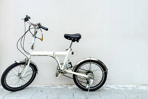 istock White Bicycle at Corner of Gray Concrete Wall with Copyspace 481883254