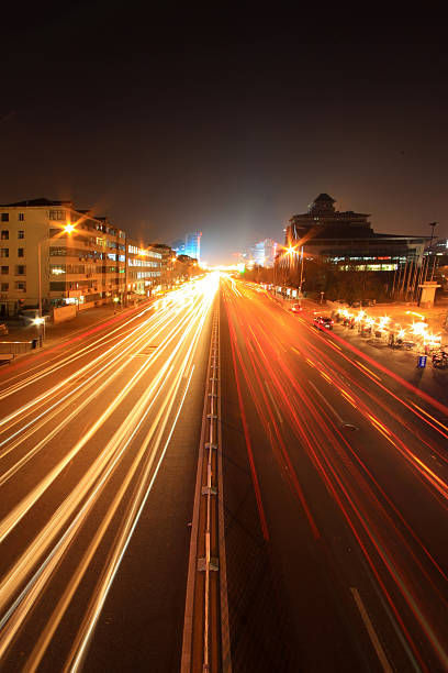 istock light trails on the modern street at night 481883867