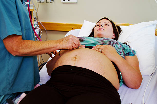 istock Nurse listening for baby's heartbeat 481885573
