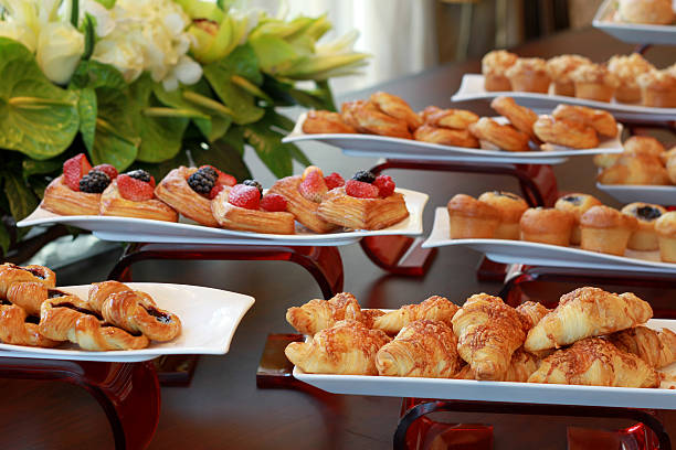 istock assorted selection of danish pastries on display with orchid flo 481891135
