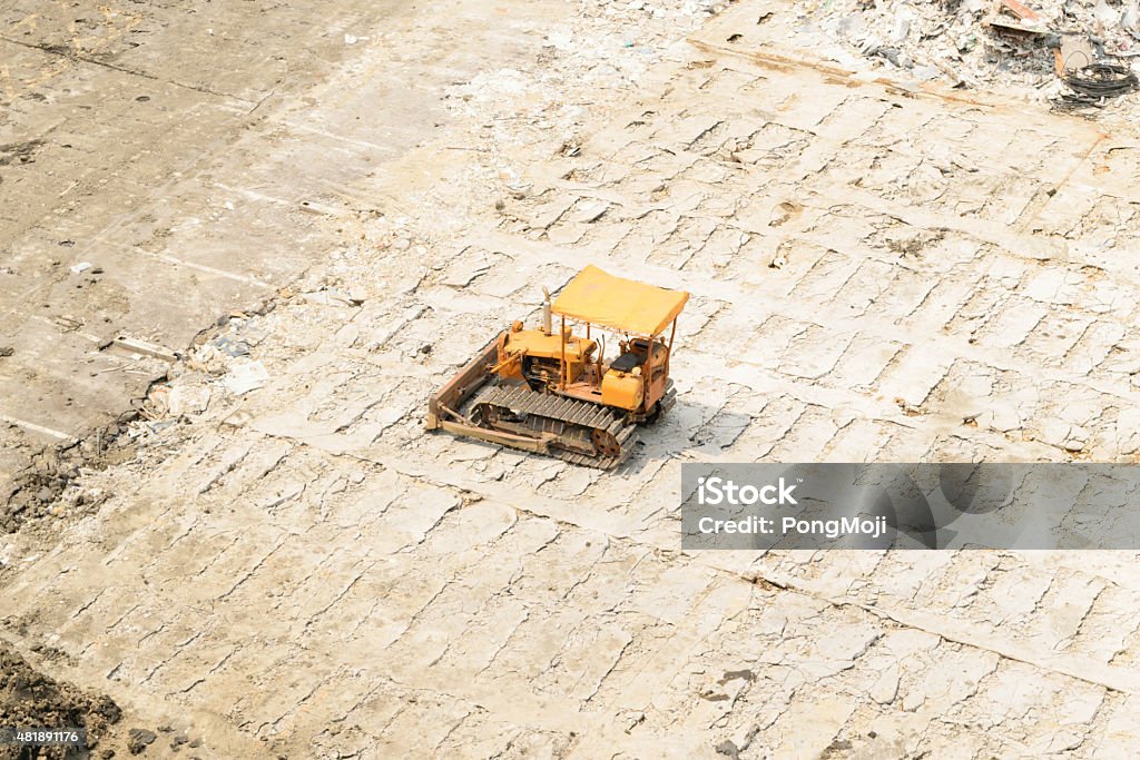 Tractor at construction site Tractor on dry soil at construction site 2015 Stock Photo