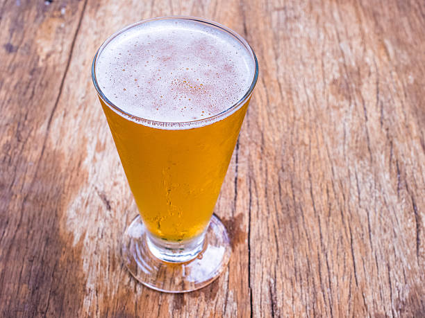 istock Closeup beer glass on wood background 481894104