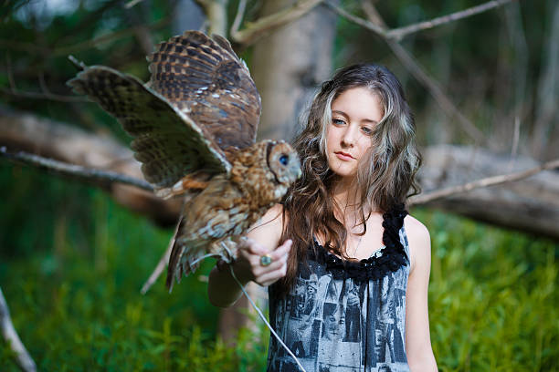 istock Beautiful young girl with owl 481894224