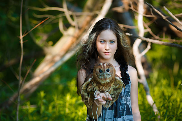 istock Beautiful young girl with owl 481894226