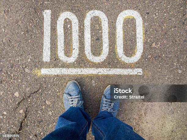 Feet On The Pavement Stock Photo - Download Image Now - Number 1000, Day, Number