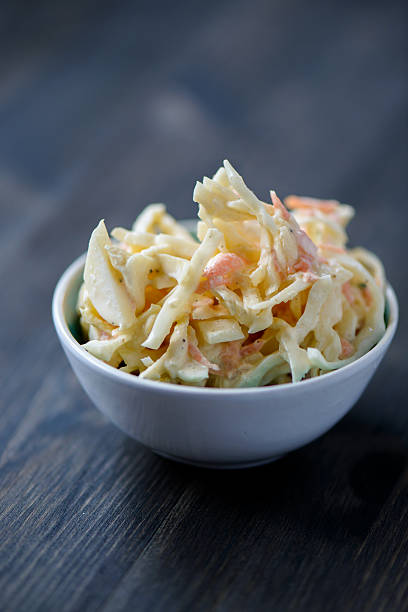 istock Coleslaw in bowl on a wooden table 481896159
