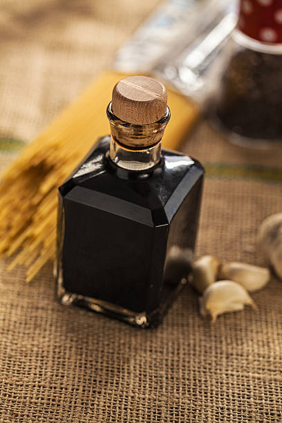 Balsamic vinegar of Modena Aceto Balzamico di Modena in small glass bottle; close up, balsamic vinegar stock pictures, royalty-free photos & images