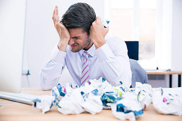istock Upset businessman sitting at the table in office 481899388
