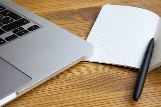 istock Notebook and pen on the wooden table 481899432