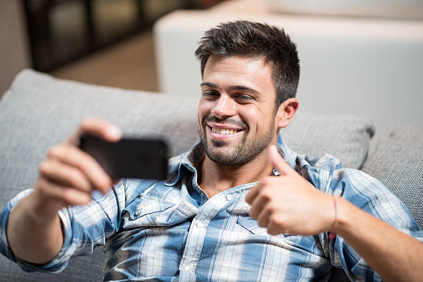 istock Young man taking selfie with phone 481899604