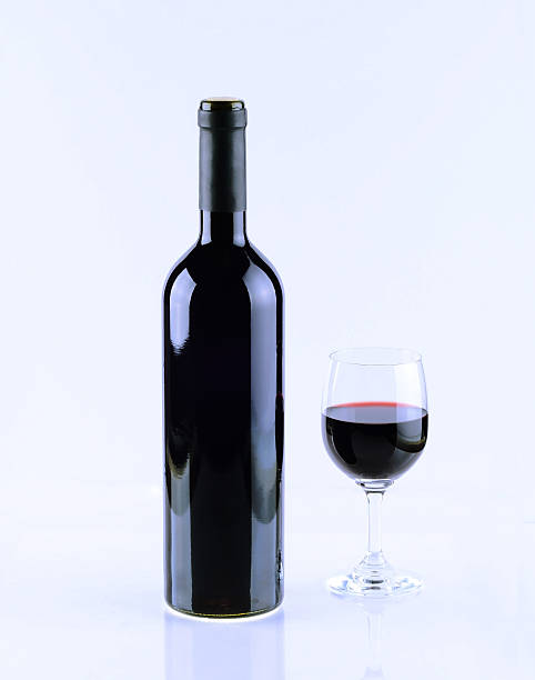 istock Bottle and glass of red wine isolated on white background. 481903802