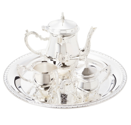 Silver tea service isolated on white.