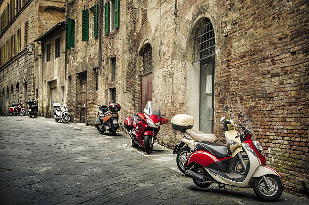 istock Motorcycles parked at a typical Italian old street 481906442