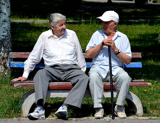 istock Two old gentleman sitting on the bench. 481907440