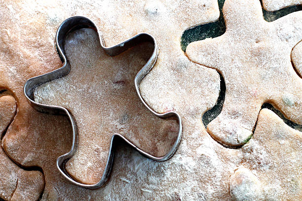 gingerbread cookies with copper cookie cutter stock photo