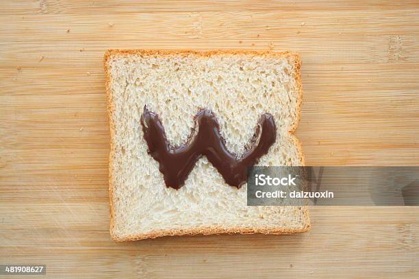 Alphabet Drawn On Slice Of Bread Stock Photo - Download Image Now - Alphabet, Bread, Breakfast