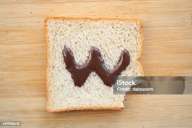 Alphabet Drawn On Slice Of Bread Stock Photo - Download Image Now - Alphabet, Biting, Bread
