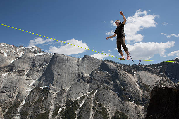 Male Slackliner Walking Yosemite Highline stock photo