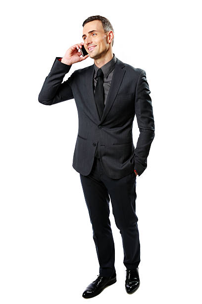 istock Smiling businessman speaking on cell phone 481910547
