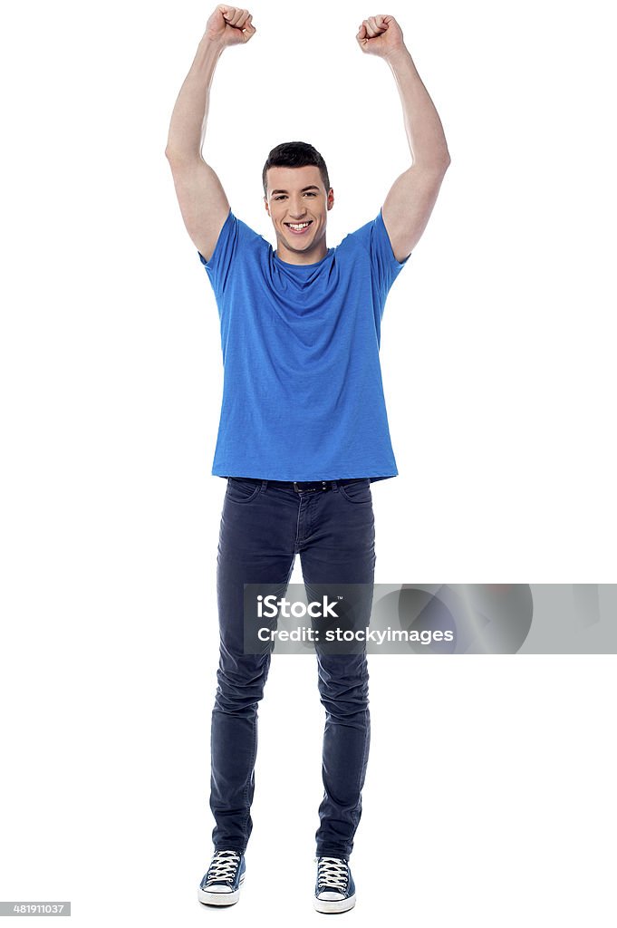 Successful smart young man Young handsome victorious guy raising hands Adult Stock Photo