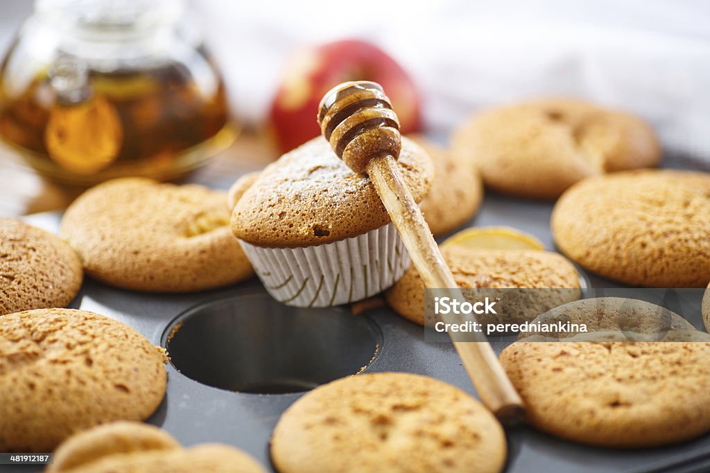 honey muffins many sweet honey muffins in baking dish Apple - Fruit Stock Photo