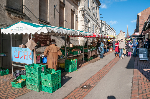 Stroud, United Kingdom - February 2, 2013: Pedestrians shopping at the busy weekend street market in Stroud, England.