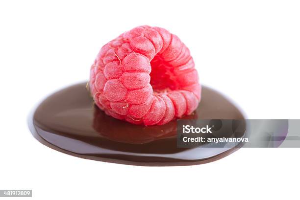 Raspberry In Chocolate Sause On White Stock Photo - Download Image Now - Chocolate, Raspberry, White Background