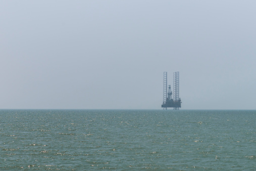 Picture of a Jackup type oil rig (Independent Leg Cantilever) in the South China Sea, ideal for background.