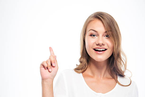 istock Woman pointing finger up and looking at camera 481914140