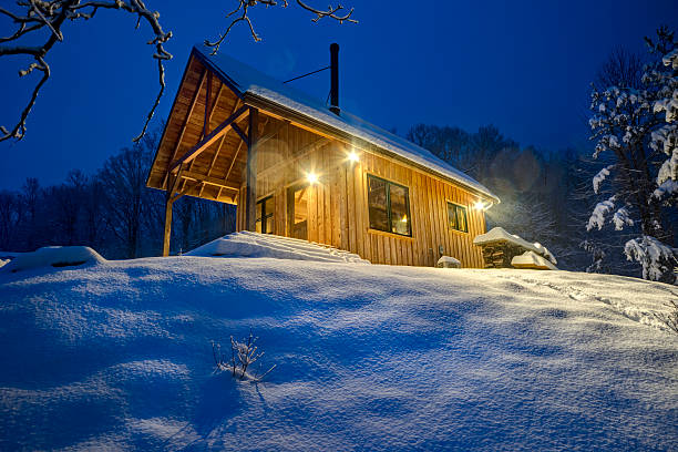 istock Rustic cabin in winter blizzard snowstorm at night 481915045
