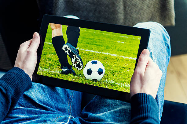 istock Watching a football match live streamed on digital tablet 481916241