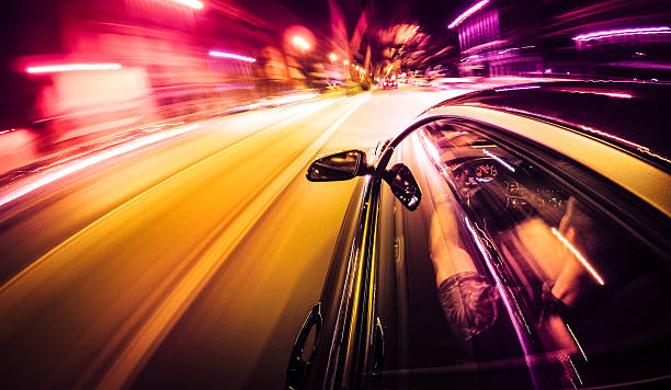 crazy ride on the night by car - spor araba stok fotoğraflar ve resimler