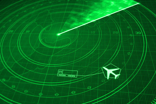 Commercial airplane icon locked on a radar simulation with green display, showing a glowing grid with digital coordinates and positioning numbers. Scanner axis is visible while spinning around the center. Jetliner is targeted and identified with symbols and numbers. Diminishing perspective with selective focus.