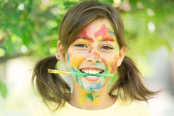 Smiling artist with paint brush