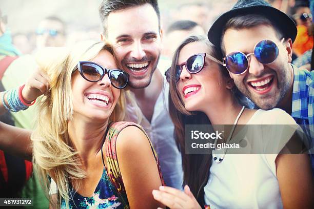 Young People Having Fun At Concert Stock Photo - Download Image Now - Sunglasses, Friendship, Music Festival