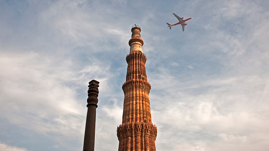 Qutub Minar or Qutb Minar in Delhi, is the tallest minaret in India made of sandstone and marble.  Construction started in 1192. Height is 72 m.  The airport is not far.