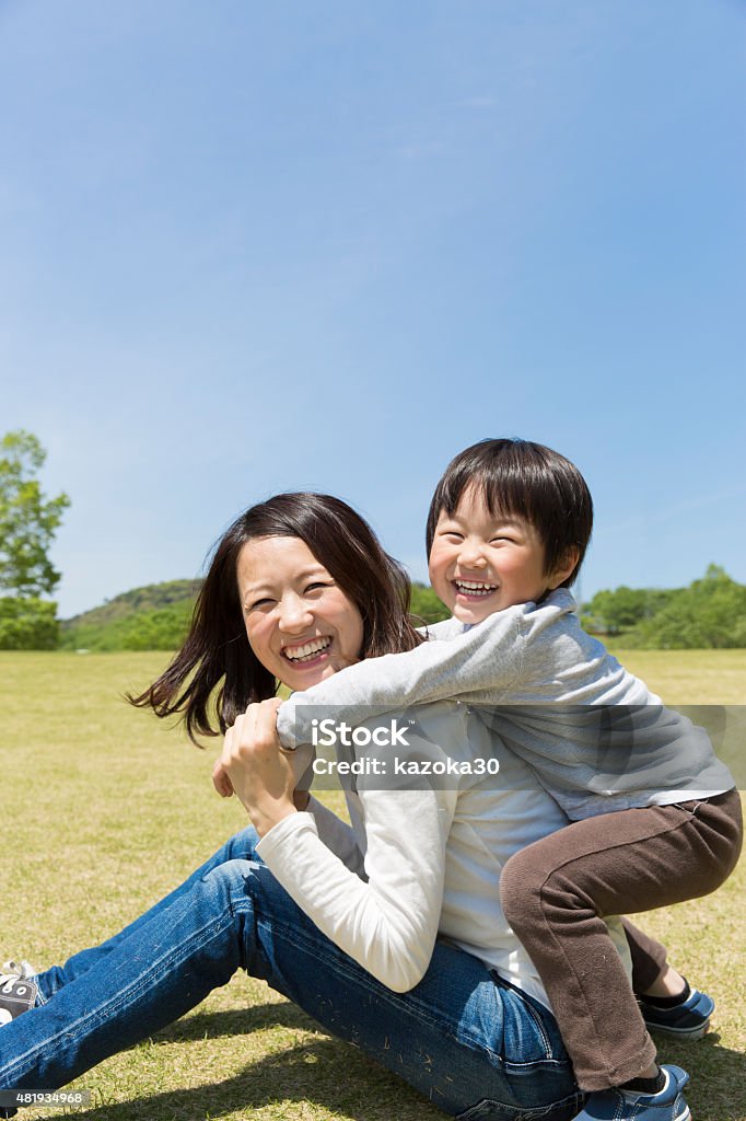 Japanese mother and child Japanese mother and child playing in the park 2015 Stock Photo