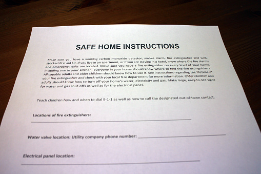 Family compiling a Safe Home Instructions Plan in case of natural disasters and other emergencies.