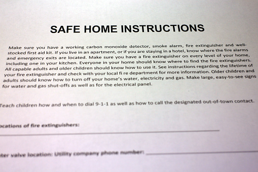 Family compiling a Safe Home Instructions Plan in case of natural disasters and other emergencies.