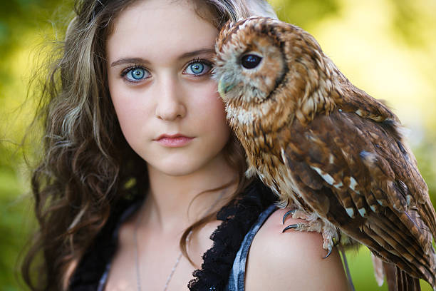 istock Beautiful young girl with owl 481936120