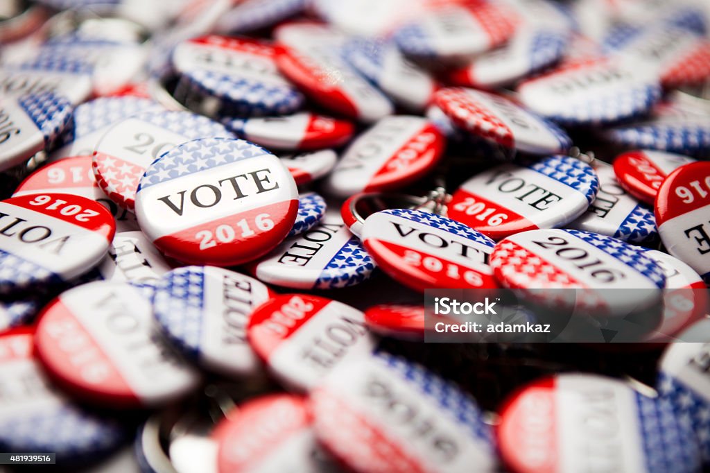 Election Vote Buttons Close up of Vote 2016 election buttons, with red, white, blue and stars and stripes. 2015 Stock Photo